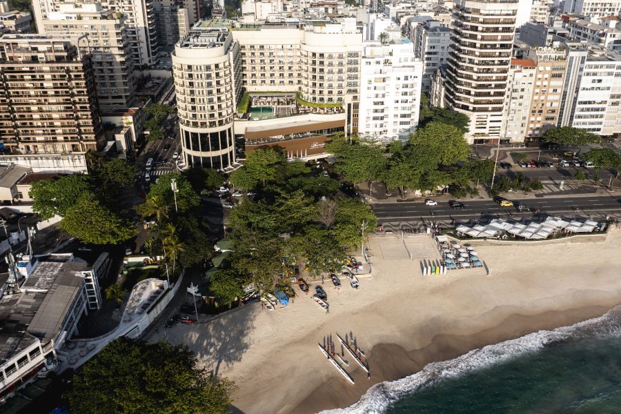 </who> A view of the Fairmont Copacabana hotel, centre, with it's chunk of beach out front.